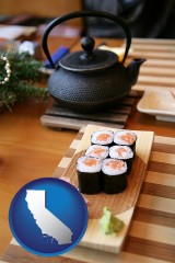 california map icon and sushi and green tea being served at a Japanese restaurant