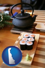delaware map icon and sushi and green tea being served at a Japanese restaurant