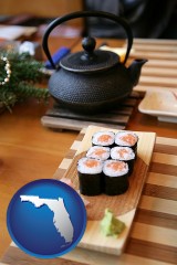 florida map icon and sushi and green tea being served at a Japanese restaurant