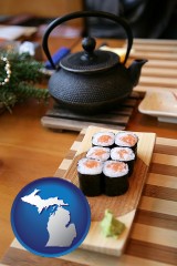 michigan map icon and sushi and green tea being served at a Japanese restaurant