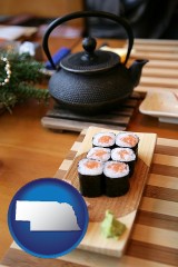 nebraska map icon and sushi and green tea being served at a Japanese restaurant