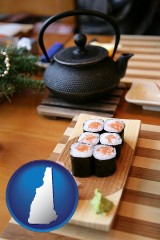new-hampshire map icon and sushi and green tea being served at a Japanese restaurant