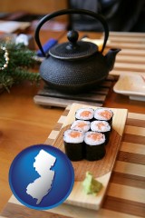 new-jersey map icon and sushi and green tea being served at a Japanese restaurant
