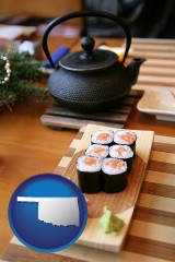 oklahoma map icon and sushi and green tea being served at a Japanese restaurant