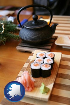 sushi and green tea being served at a Japanese restaurant - with Alaska icon