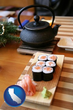 sushi and green tea being served at a Japanese restaurant - with California icon