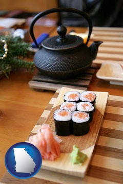 sushi and green tea being served at a Japanese restaurant - with Georgia icon