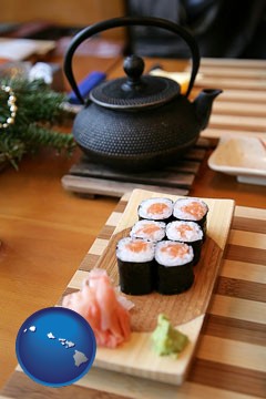 sushi and green tea being served at a Japanese restaurant - with Hawaii icon