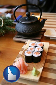 sushi and green tea being served at a Japanese restaurant - with Idaho icon