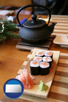 sushi and green tea being served at a Japanese restaurant - with Kansas icon