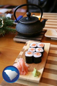 sushi and green tea being served at a Japanese restaurant - with South Carolina icon