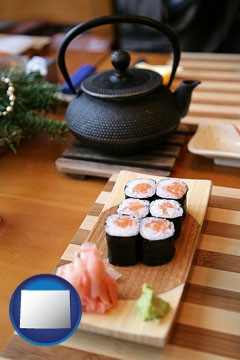 sushi and green tea being served at a Japanese restaurant - with Wyoming icon