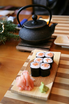 sushi and green tea being served at a Japanese restaurant